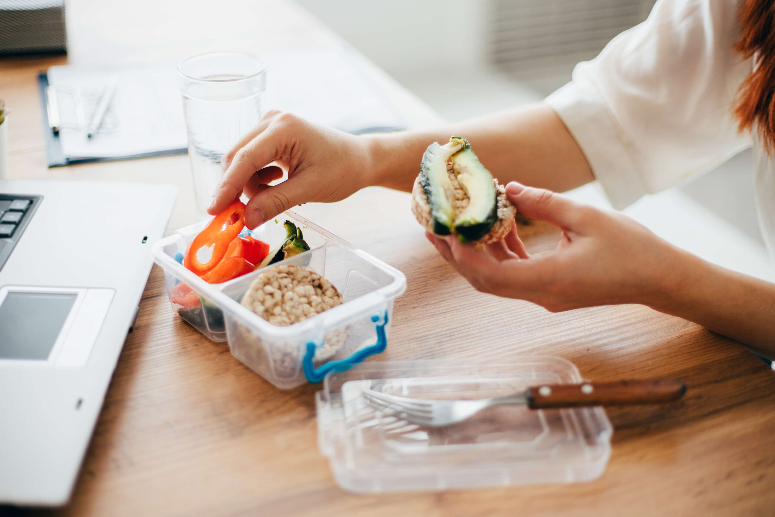A woman eating healthy snacks.