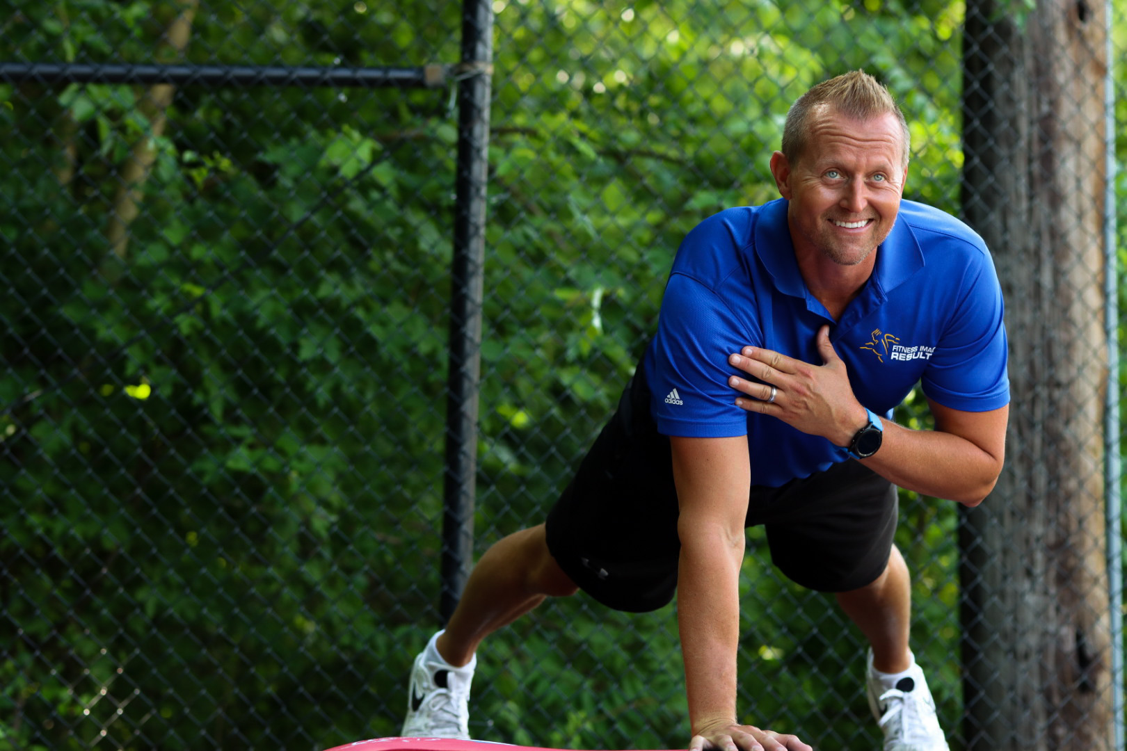 A Fitness Image Results coach doing a functional core exercise.